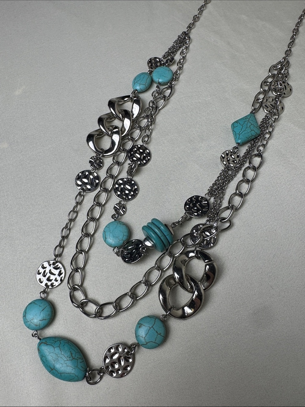 Multi-Strand Silver Necklace with Turquoise Beads and Unique Textures